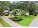 Beautifully landscaped front yard with lush greenery and a circular driveway at 1655 Oak Crest Ct, Marietta, GA 30066