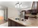Kitchen island with granite countertops and stainless steel dual sinks at 1655 Oak Crest Ct, Marietta, GA 30066