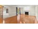 Large living room with hardwood floors, a fireplace, and an open doorway to another living space at 1655 Oak Crest Ct, Marietta, GA 30066