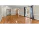 Bright living room with hardwood floors, large window, and elegant blue curtains at 1655 Oak Crest Ct, Marietta, GA 30066