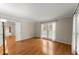 Spacious living room with hardwood floors and a large window, creating a bright and welcoming space at 1655 Oak Crest Ct, Marietta, GA 30066