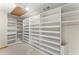 Spacious walk-in closet featuring custom built-in shelving for maximum organization at 1655 Oak Crest Ct, Marietta, GA 30066