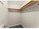 Spacious walk-in closet with light wood shelving and chrome rods to maximize organization and storage at 1655 Oak Crest Ct, Marietta, GA 30066