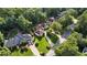 Aerial view of the property showing its location among mature trees at 2050 Trotters Ridge Way, Roswell, GA 30075