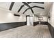 Entertainment area features a wet bar with custom accent wall and adjacent exit door at 1065 Beacon Hill Xing, Alpharetta, GA 30005