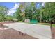 Outdoor basketball court surrounded by mature trees at 1065 Beacon Hill Xing, Alpharetta, GA 30005