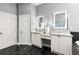 Bathroom featuring dual sinks, modern lighting, and granite countertops at 1065 Beacon Hill Xing, Alpharetta, GA 30005