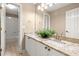 Bathroom with double vanity, granite counters, and views of a tiled shower with tub at 1065 Beacon Hill Xing, Alpharetta, GA 30005