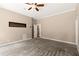 Large bedroom with ceiling fan, plush carpeting and access to a walk-in closet at 1065 Beacon Hill Xing, Alpharetta, GA 30005