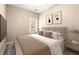 Cozy bedroom featuring neutral tones, plush bedding, a large window, and modern furnishings at 1065 Beacon Hill Xing, Alpharetta, GA 30005