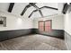 Bedroom with paneled wainscoting, dark ceiling beams and plenty of natural light at 1065 Beacon Hill Xing, Alpharetta, GA 30005