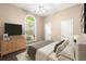 Bedroom featuring neutral walls, carpeted floors, and a large window for plenty of natural light at 1065 Beacon Hill Xing, Alpharetta, GA 30005