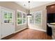 Bright breakfast nook with natural light, hardwood floors, and views of the outdoors at 1065 Beacon Hill Xing, Alpharetta, GA 30005
