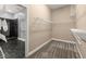 Walk-in closet with built-in shelving and access to a modern bathroom with walk-in shower at 1065 Beacon Hill Xing, Alpharetta, GA 30005