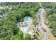 Aerial view of the sparkling community pool and surrounding lush landscape at 1065 Beacon Hill Xing, Alpharetta, GA 30005