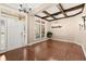 Inviting foyer featuring wood floors, large windows, and decorative light fixtures, creating an open atmosphere at 1065 Beacon Hill Xing, Alpharetta, GA 30005