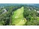 Beautiful aerial view of a lush green golf course surrounded by mature trees at 1065 Beacon Hill Xing, Alpharetta, GA 30005