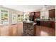 Kitchen with stone island, stainless steel appliances, and access to the backyard at 1065 Beacon Hill Xing, Alpharetta, GA 30005