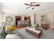 Modern living room seamlessly connects with the kitchen featuring a stone island at 1065 Beacon Hill Xing, Alpharetta, GA 30005