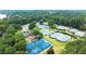Overhead shot of multiple tennis courts surrounded by trees, enhancing the sports and recreational atmosphere at 1065 Beacon Hill Xing, Alpharetta, GA 30005