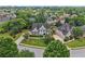 Beautiful aerial view of home and neighborhood, showcasing landscaping and mature trees at 2444 Mossy Branch Dr, Snellville, GA 30078