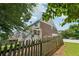 Fenced backyard featuring the home's back porch, perfect for relaxing outdoors at 2444 Mossy Branch Dr, Snellville, GA 30078