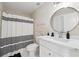 Bathroom featuring shower/tub combo with a white vanity at 2444 Mossy Branch Dr, Snellville, GA 30078