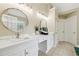 Bright bathroom featuring double vanity and granite countertop at 2444 Mossy Branch Dr, Snellville, GA 30078