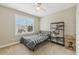 Neutral bedroom with a ceiling fan, carpeted floor, and large window with blinds at 2444 Mossy Branch Dr, Snellville, GA 30078