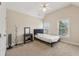 Vaulted bedroom featuring two windows and a black vanity at 2444 Mossy Branch Dr, Snellville, GA 30078
