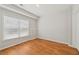 Bedroom featuring a window with blinds and hardwood floors at 2444 Mossy Branch Dr, Snellville, GA 30078