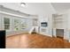 Bonus room with built-in cabinets, desk, and access to additional attic space at 2444 Mossy Branch Dr, Snellville, GA 30078