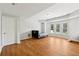 Spacious bonus room featuring wood flooring, large windows, and a door at 2444 Mossy Branch Dr, Snellville, GA 30078