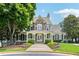 Community clubhouse with stone accents, inviting entrance, and manicured landscaping at 2444 Mossy Branch Dr, Snellville, GA 30078