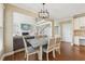 View from the dining room toward the living room, showcasing open layout and high ceilings at 2444 Mossy Branch Dr, Snellville, GA 30078
