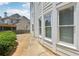 Exterior view of the house showcasing the siding, windows, and landscaped backyard at 2444 Mossy Branch Dr, Snellville, GA 30078