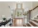 Inviting foyer with hardwood floors, high ceilings, and a staircase leading to the upper level at 2444 Mossy Branch Dr, Snellville, GA 30078