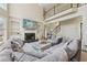 Bright living room with fireplace, built-in shelving, high ceilings and comfortable seating at 2444 Mossy Branch Dr, Snellville, GA 30078