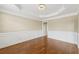 Spacious room with tray ceiling, chair rail and hardwood flooring at 2444 Mossy Branch Dr, Snellville, GA 30078
