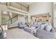 Open-concept living space with stairs leading to the upper level, adjacent to the kitchen at 2444 Mossy Branch Dr, Snellville, GA 30078