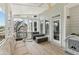 Covered patio featuring a porch swing, cushioned furniture and overhead fan at 2444 Mossy Branch Dr, Snellville, GA 30078