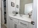Bathroom with a vanity, a mirror, modern fixtures, and storage space for toiletries at 3227 Hidden Valley Cir, Lawrenceville, GA 30044