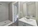 Bathroom with updated fixtures and tiled shower at 971 Sims Nw Ave, Atlanta, GA 30318