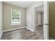 Bright bedroom with hardwood floors and a large window offering natural light at 971 Sims Nw Ave, Atlanta, GA 30318