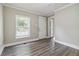 A bright entryway with modern gray wood flooring and ample natural light at 971 Sims Nw Ave, Atlanta, GA 30318