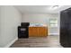 Cozy kitchen features gray flooring, neutral paint, and essential appliances at 971 Sims Nw Ave, Atlanta, GA 30318