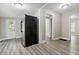Bright kitchen with multiple entrances and modern flooring adjacent to appliances at 971 Sims Nw Ave, Atlanta, GA 30318