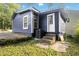 Home's exterior showcasing backyard access with an AC unit and concrete steps at 971 Sims Nw Ave, Atlanta, GA 30318