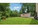 Large backyard showing the lawn and a detached garage, and air conditioning at 1978 Ethel Ln, Decatur, GA 30032