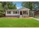 Charming, renovated home with a well-manicured lawn and a covered carport at 1978 Ethel Ln, Decatur, GA 30032